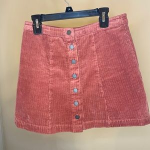 A dusty pink corduroy skirt
